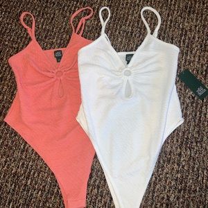 TWO matching body suits with cutout
